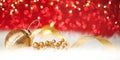 Christmas gold ball on red glitter background Royalty Free Stock Photo