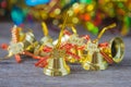 Christmas gold bells with bokeh decorations background. Royalty Free Stock Photo