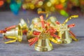 Christmas gold bells with bokeh decorations background. Royalty Free Stock Photo