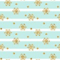 Christmas gold snowflake seamless pattern. Golden glitter snowflakes on blue white lines background. Winter snow texture Royalty Free Stock Photo