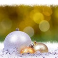 Golden background with bokeh lights, two gold balls and one silver ball Royalty Free Stock Photo