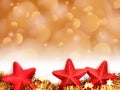 Christmas golden bokeh background with red star decorations Royalty Free Stock Photo