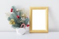 Christmas Golden Frame poster mock up template with New Year bouquet. Red, gold