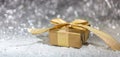 Christmas golden gift box on abstract bokeh lights and glitter background Royalty Free Stock Photo