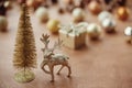 Christmas golden glitter tree and reindeer on background of gift Royalty Free Stock Photo