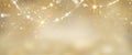 Christmas golden glowing background. Holiday abstract glitter defocused backdrop with blinking tars and garlands Royalty Free Stock Photo