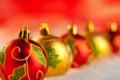 Christmas golden red baubles in a row with lights Royalty Free Stock Photo