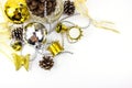 Christmas golden and silver decorations on white background. Basket weave on table top view