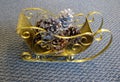 Christmas golden sleigh decor with pine cones