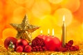 Christmas golden star with red candles Royalty Free Stock Photo