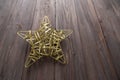 Christmas golden star on wooden brown background Royalty Free Stock Photo