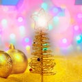 Christmas golden tree with baubles and lights Royalty Free Stock Photo