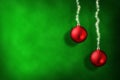 Christmas green background with red balls and ribbon stars Royalty Free Stock Photo