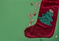 Christmas green background with Christmas tree on Xmas sock and decorations. New Year greeting card. Royalty Free Stock Photo