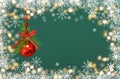 Christmas green background with snowflakes borders, yellow lights and red holiday decorations Royalty Free Stock Photo