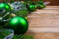 Christmas green baubles on wooden background, copy space Royalty Free Stock Photo