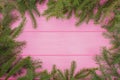 Christmas green framework on pink background. Royalty Free Stock Photo