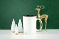 Christmas green theme product mockup with gold reindeer and white Xmas trees.