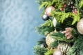 Christmas green tree decorated with balls and cones on a blue background