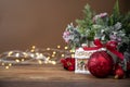 Christmas greenting card, winter decoration, wooden background and bokeh lights