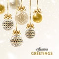 Christmas greeting card. Christmas baubles hang on golden ribbon