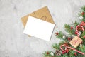 Christmas greeting card with fir tree, festive decorations and gift box on gray concrete background. Mock up Royalty Free Stock Photo