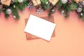 Christmas greeting card with fir tree, holiday decorations, gift boxes on peach fuzz color background. Flat lay. Mock up Royalty Free Stock Photo