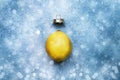 Christmas greeting card with lemon on blue background