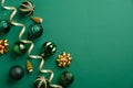 Christmas greeting card mockup. Elegant Xmas baubles and golden decorations on green background. Flat lay, top view