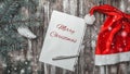 Christmas greeting card on old wooden background with space where you can leave a message for Santa. Royalty Free Stock Photo