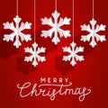 Christmas greeting card with paper snowflakes on red background for Your holiday design Royalty Free Stock Photo