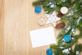 Christmas greeting card or photo frame over wooden table with sn Royalty Free Stock Photo