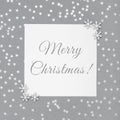 Christmas greeting card with silver snowflakes on grey background. Postcard with the text Merry Christmas. Happy New Year. Winter Royalty Free Stock Photo