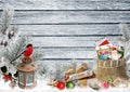 Christmas greeting card with space for text, with gifts, a lantern, a bullfinch, a bag of letters and sweets on a snowy wooden boa Royalty Free Stock Photo