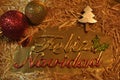 Christmas gretting card. Balls, straw and golden ornaments. Feliz Navidad Royalty Free Stock Photo