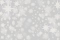 Christmas grey background with a lots of snow flakes and stars w