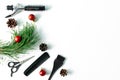 Christmas hairdresser accessories with combs, brush, scissors, tools with new year decorations on white background