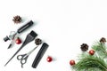 Christmas hairdresser composition with combs, brush, scissors, tools and accessories with new year decorations on white