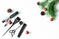 Christmas hairdresser composition with combs, brush, scissors, tools and accessories with new year decorations on white