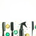 Christmas hairdresser composition with spray, combs and decoration on white background. Flat lay, top view