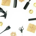 Christmas hairdresser frame composition with spray, combs, scissors and gift box with balls on white background. Flat lay, top vie