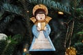 Christmas- A Handmade Ceramic Angel Ornament Hanging on a Tree Royalty Free Stock Photo