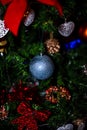 Christmas hanging decorations on fir tree. Decorated Christmas tree. Fir branch with Christmas baubles decorations Royalty Free Stock Photo