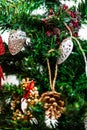 Christmas hanging decorations on fir tree. Decorated Christmas tree. Fir branch with Christmas baubles decorations Royalty Free Stock Photo