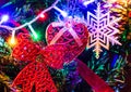 Christmas hanging decorations on fir tree. Decorated Christmas tree. Fir branch with Christmas decorations surrounded by lights Royalty Free Stock Photo