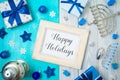 Christmas and Hanukkah celebration concept. Winter holidays background with photo frame, gift boxes and traditional decorations