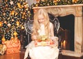 Christmas happy child little girl with gift box home Royalty Free Stock Photo