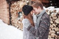 Christmas happy couple in love embrace in snowy winter cold forest, copy space, new year party celebration, holiday and
