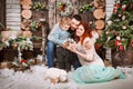 Christmas happy family of three persons and fir tree with gift boxes new year winter decorated background Royalty Free Stock Photo