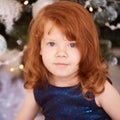 Christmas happy girl. Luxury attractive red hair child. Xmas miracle